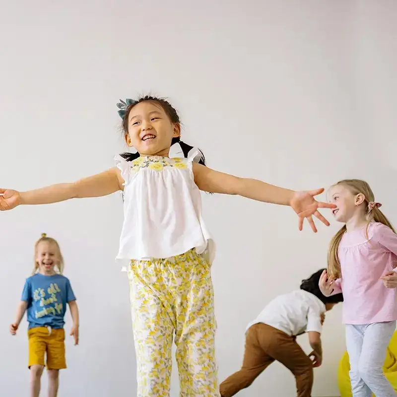 kids playing excitedly in gym setting